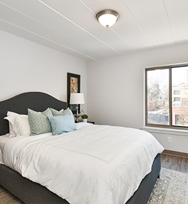the bedroom with a hardwood floor